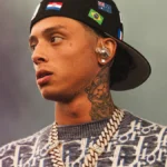 Central Cee performing on stage holding a microphone